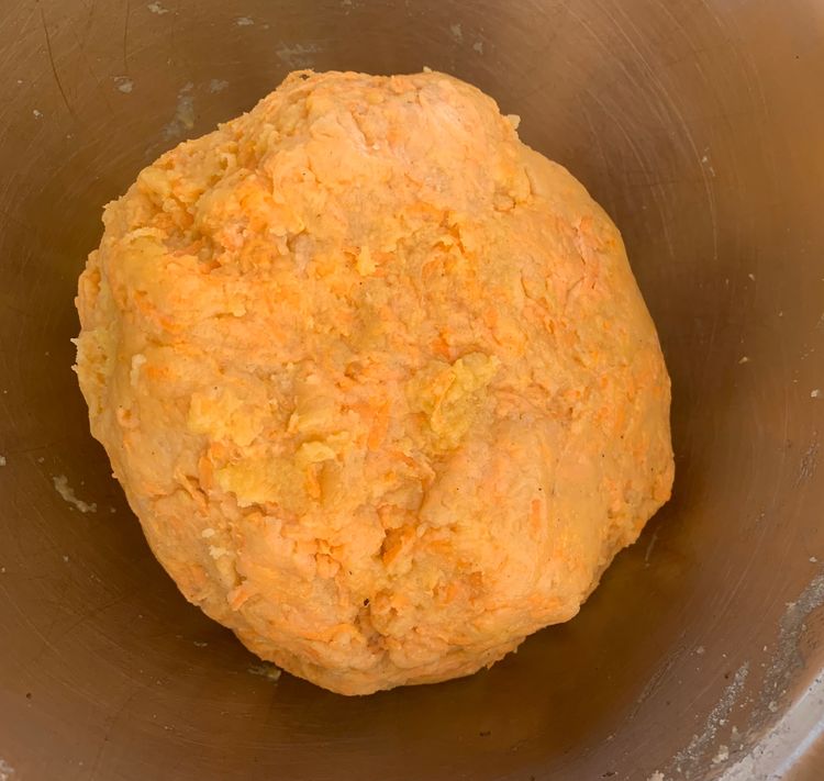 Step 1.2: Gradually incorporate the flour mixture into the wet ingredients, gently stirring with a spatula until a soft dough forms