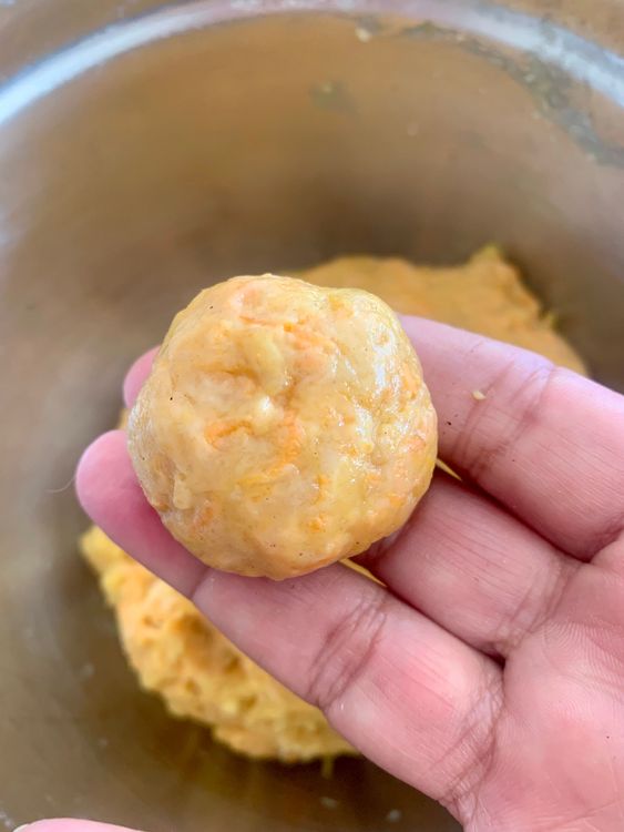Step 1.1: Using a spoon or cookie scoop, shape small portions of the dough into walnut-sized balls
