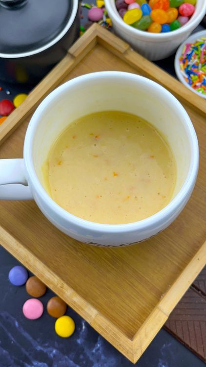 Step 1.2: Add the egg yolk, melted butter, orange juice, orange zest, and vanilla extract