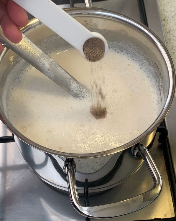 Step 1.2: Add the sugar and green cardamom powder to the milk