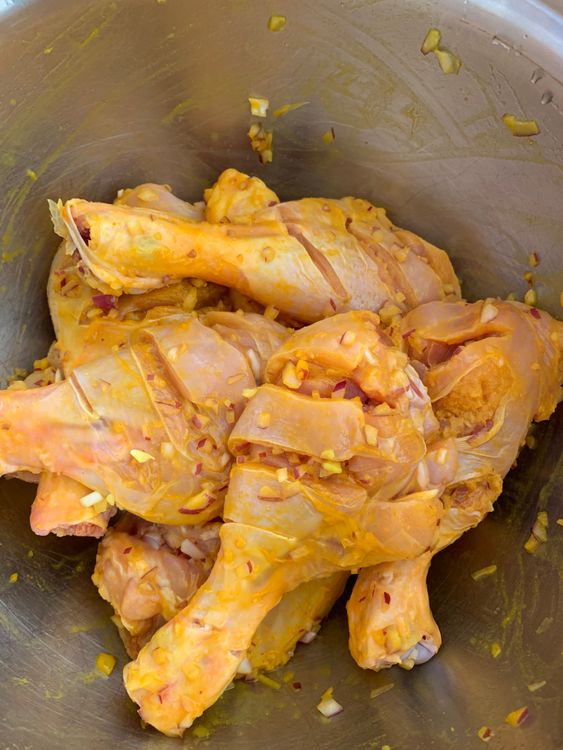 Step 1.2: Add lemon juice, turmeric powder, salt, and the finely chopped onion to the bowl