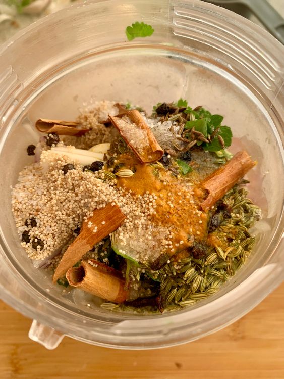Step 2.2: In a blender, combine the fresh coriander leaves and stalks, mint leaves, onion, green chilies, garlic cloves, ginger, black peppercorns, cumin seeds, cloves, cinnamon stick, turmeric powder, poppy seeds, lemon juice, oil, and salt