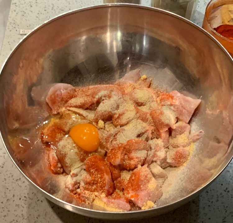 Step 2.2: In a mixing bowl, add the chicken pieces
