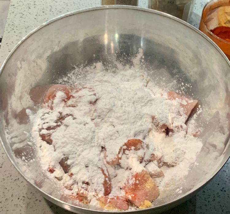 Step 2.1: In a mixing bowl, add the chicken pieces