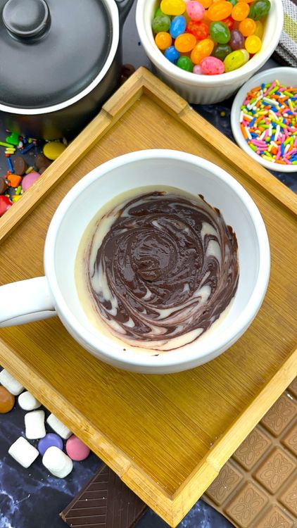 Step 3.1: Drop alternating spoonfuls of vanilla and chocolate batter, then swirl gently with a toothpick