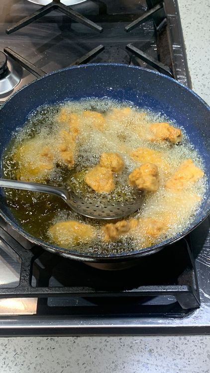 Step 3.1: Add the marinated chicken pieces (in batches) to the hot oil