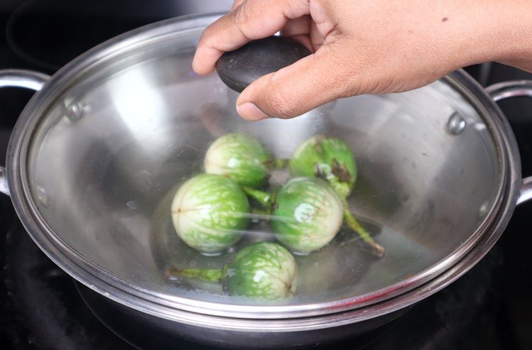 Step 2.3: Heat oil in a [thick-bottomed kadai ](https://amzn