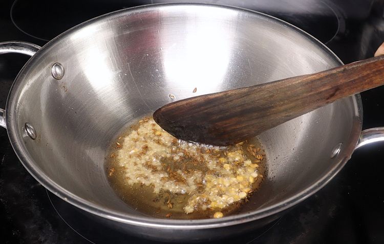 Step 2.5: In the same kadai, add mustard seeds, cumin seeds, urad dal, and chana dal