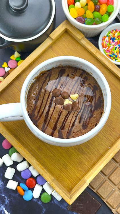 Step 5.1: Spread frosting over the warm mug cake — it will slightly melt for a glossy finish