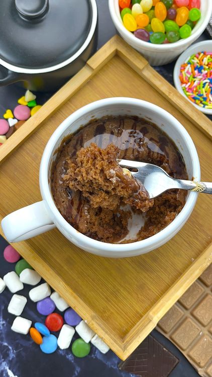 Step 5.2: Spread frosting over the warm mug cake — it will slightly melt for a glossy finish