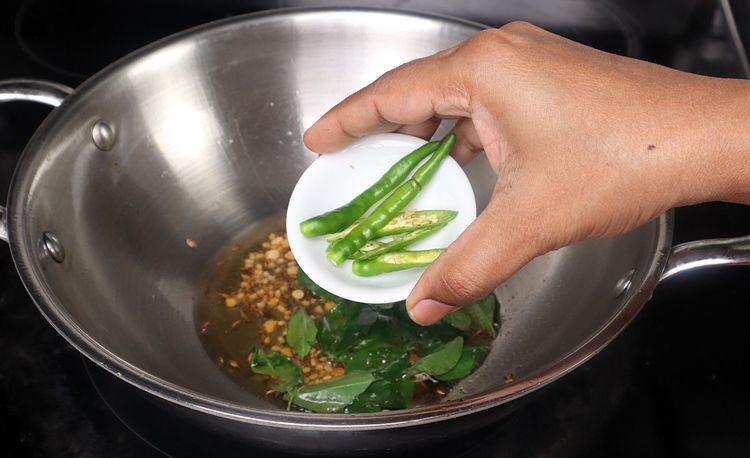 Step 2.2: Add chopped onion, green chili, and curry leaves