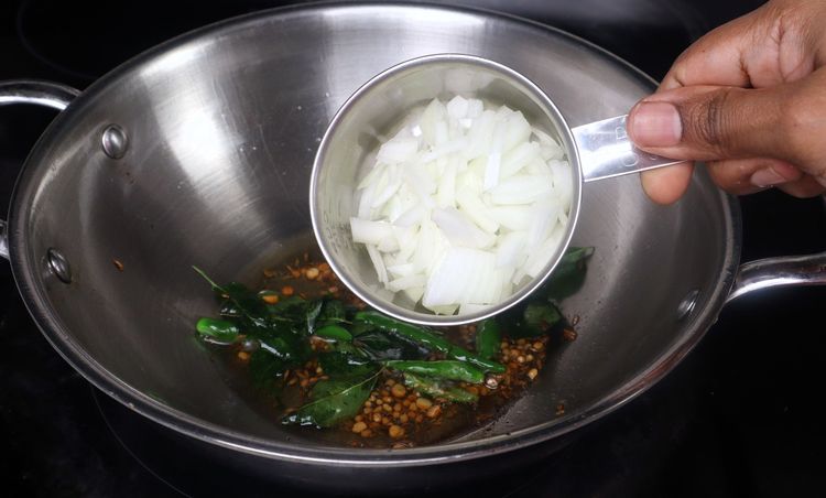 Step 2.4: Add chopped onion, green chili, and curry leaves