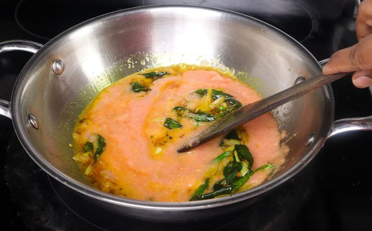 Step 2.4: Add turmeric powder to the kadai and sauté