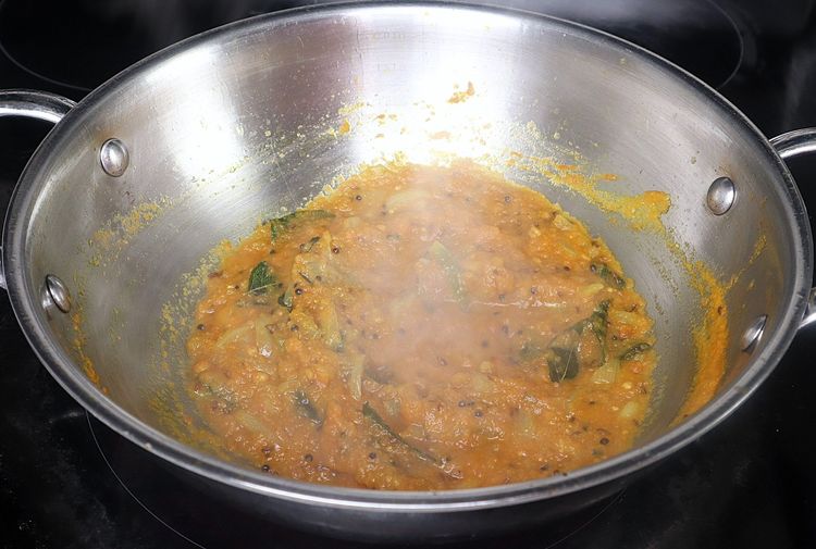 Step 2.6: Add turmeric powder to the kadai and sauté