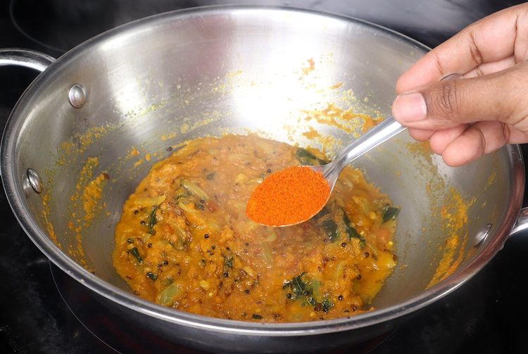 Step 2.1: Add red chili powder, salt, and coriander powder