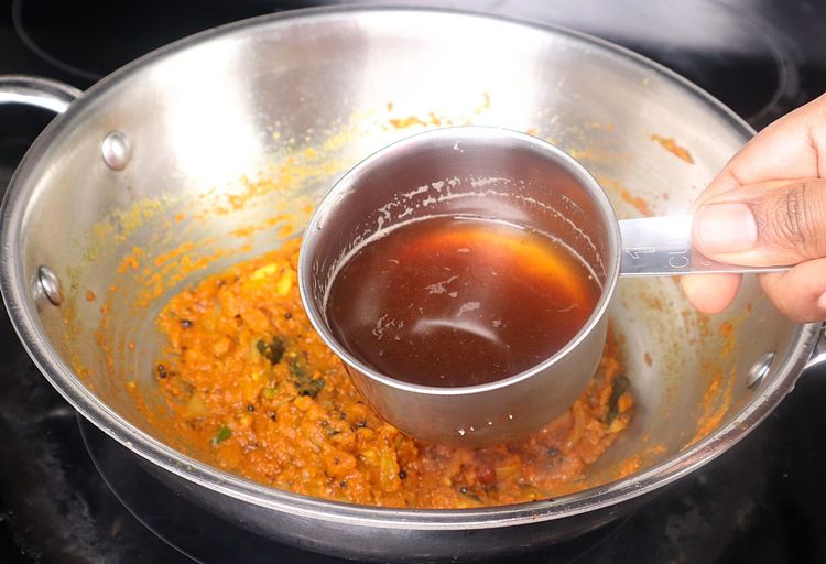 Step 2.1: Add tamarind pulp and sauté for a few minutes on medium to low flame until the curry thickens