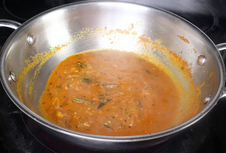 Step 2.3: Add tamarind pulp and sauté for a few minutes on medium to low flame until the curry thickens