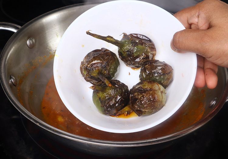 Step 2.1: Add the fried brinjals and sauté well