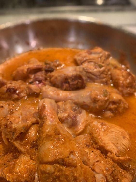Step 2.1: Once the chicken pieces have lightened in colour, add water, stir and wait for a boil
