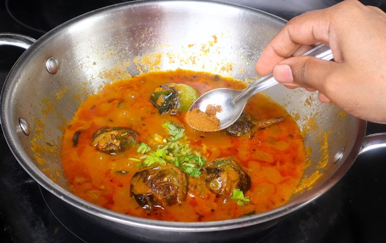 Step 2.4: Open the lid, add the chopped coriander leaves and [garam masala powder,](https://amzn