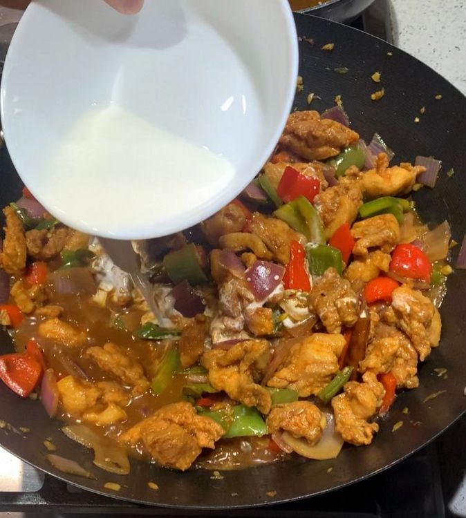 Step 3.1: Gradually add the slurry to the pan while stirring continuously