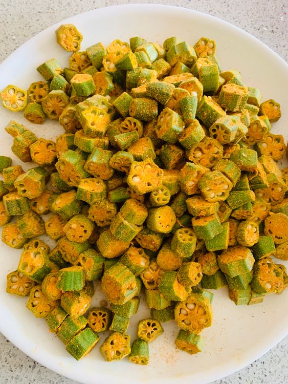 Step 1.1: Transfer the Bhindi to a separate plate, leaving the excess spices in the bowl