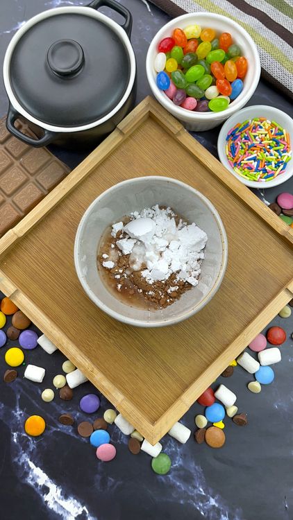 Step 2.1: In a small bowl, mix cocoa powder, powdered sugar, and water until smooth and glossy