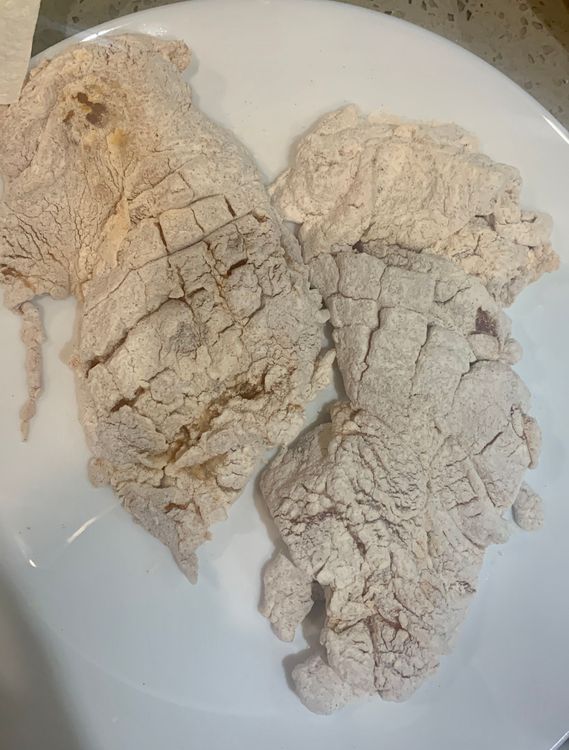 Step 2.1: After dipping in chilled water, coat the chicken fillet again with the flour mixture