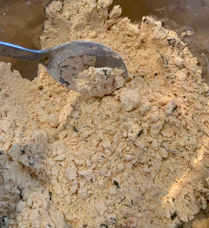 Step 1.2: Mix gram flour, green chillies, salt, red chilli powder, coriander seeds, garam masala, dry pomegranate seeds, carom seeds, garlic powder, dry fenugreek leaves, garlic powder, baking powder and baking soda in a large mixing bowl
