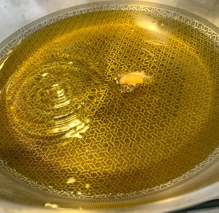 Step 1.1: Heat oil in a heavy-bottomed deep pan or kadhai on medium heat