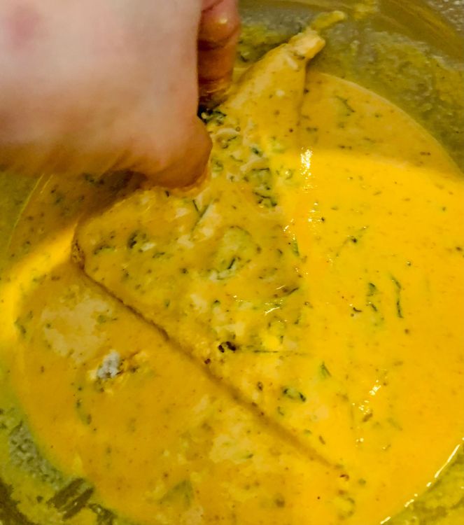 Step 1.1: Dip the slice of bread into the batter, then hold it straight for a second or two so that any excess batter drains off