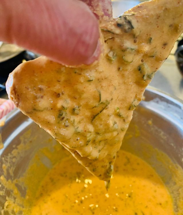 Step 1.2: Dip the slice of bread into the batter, then hold it straight for a second or two so that any excess batter drains off