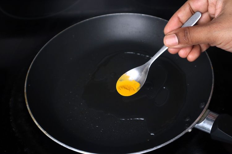 Step 2.2: In the same pan, add 1 tsp oil, turmeric powder, red chilli powder, and salt
