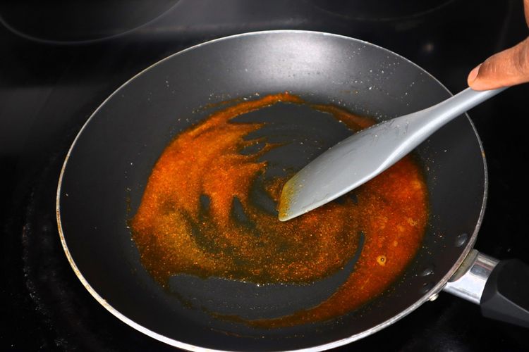 Step 2.7: In the same pan, add 1 tsp oil, turmeric powder, red chilli powder, and salt
