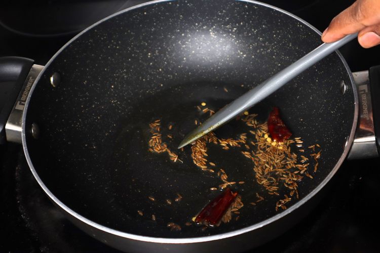 Step 2.4: In a kadai, add 2 tbsp oil on medium flame