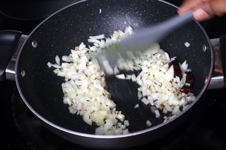 Step 2.3: Add finely chopped onions and sauté until they become soft and translucent
