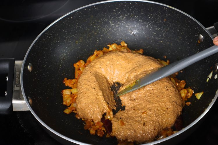 Step 2.2: Add the ground spice paste and sauté until oil separates from the gravy