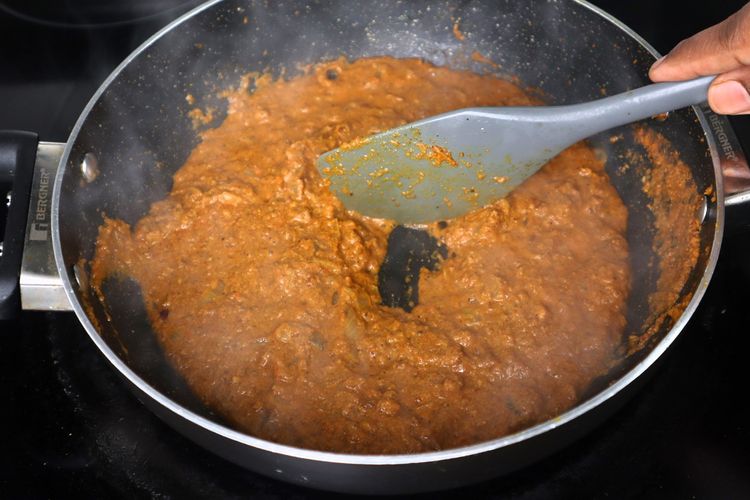 Step 2.3: Add tomato puree and sauté until oil separates