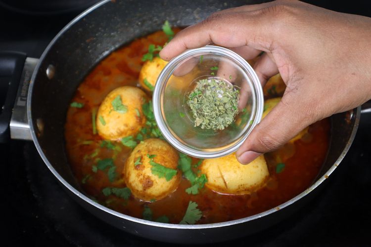 Step 2.4: Open the lid, adjust the salt, and add coriander leaves and [kasuri methi](https://amzn
