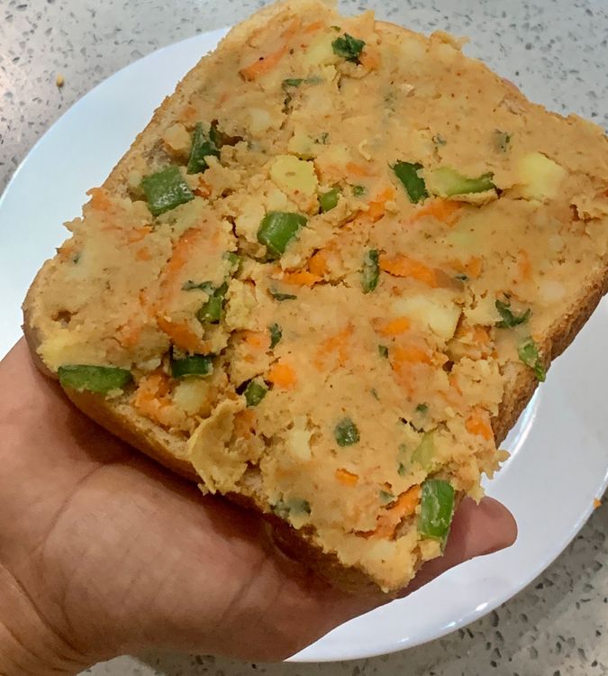 Step 1.1: Take a bread slice and use a spoon to spread a small amount of the potato mixture on it