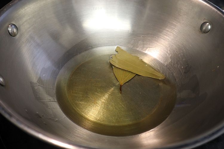Step 1.1: In a kadai, heat oil over medium heat