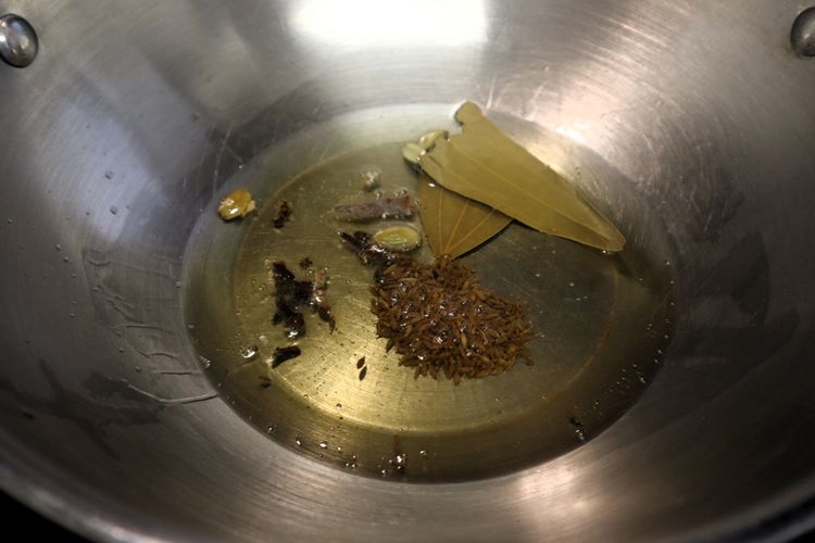 Step 1.2: In a kadai, heat oil over medium heat
