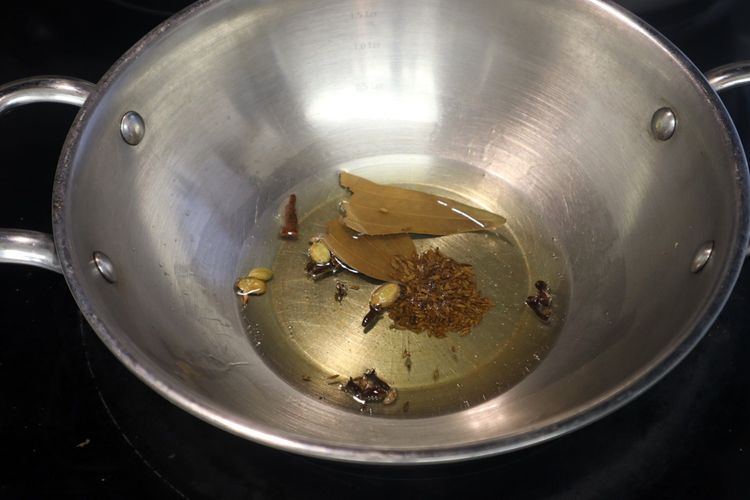 Step 1.3: In a kadai, heat oil over medium heat