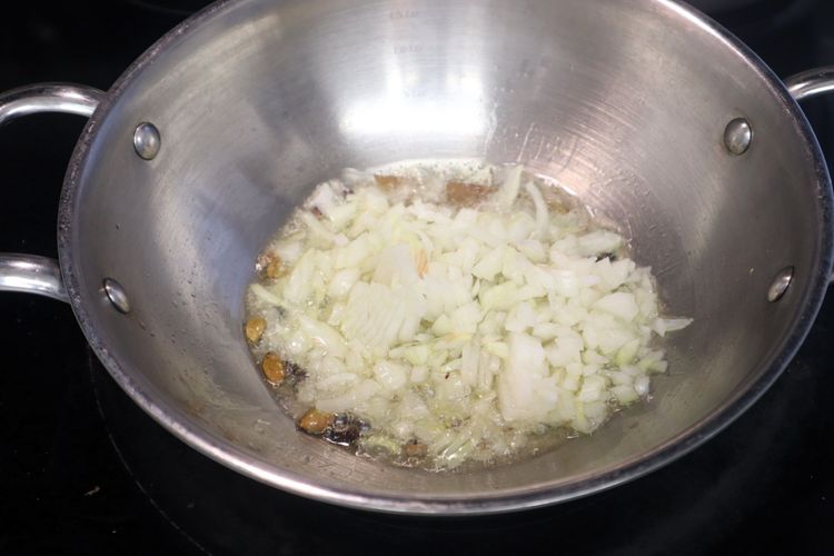 Step 1.2: Add finely chopped onion and sauté for 1 minute