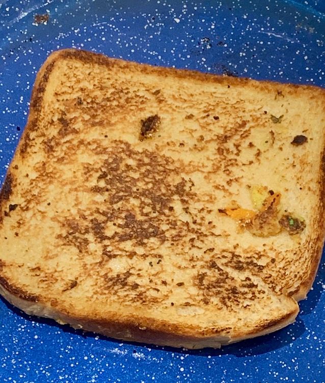Step 1.2: Use a flat spatula to carefully flip the bread slices and cook for a few more minutes until they become golden brown and crispy below