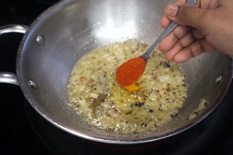 Step 1.2: Add turmeric powder, red chili powder, coriander powder, and cumin powder