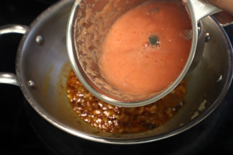 Step 2.1: Add the tomato puree and cook until the oil starts separating from the mixture