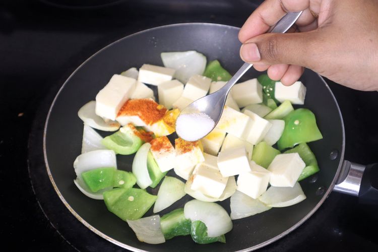 Step 3.5: Add paneer cubes, salt, red chili powder, and black pepper
