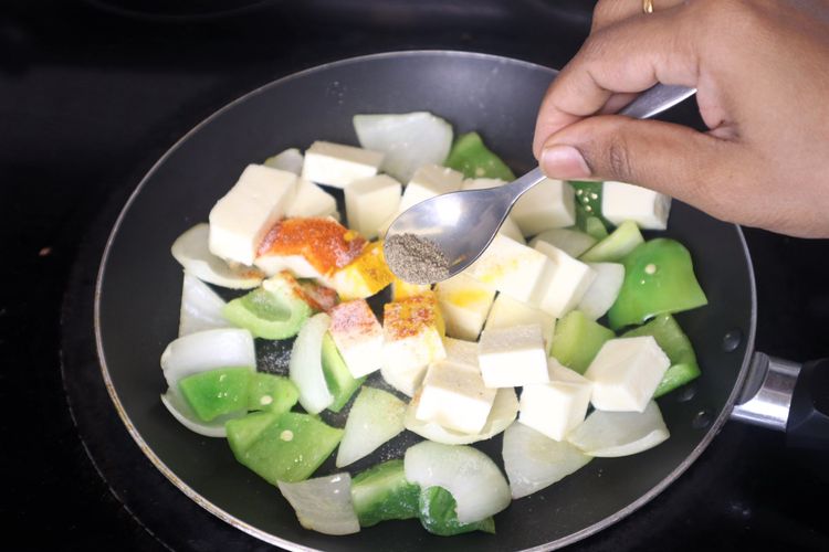 Step 3.6: Add paneer cubes, salt, red chili powder, and black pepper