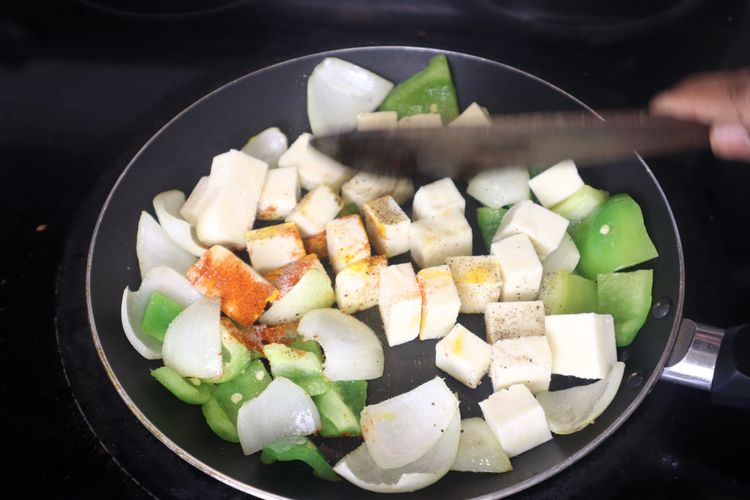 Step 3.7: Add paneer cubes, salt, red chili powder, and black pepper